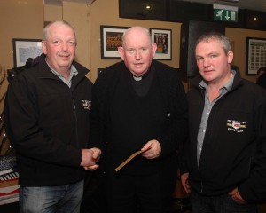Fr Eddie Gallagher PP KIlcar receives a cheque for the Carrick Sheltered Housing for E360 from Brendan Byrne and Aaron O'Shea on the Midwest Donegal Vintage Club, part proceeds of their Kilcar Tractor run. (John/jmac.ie)